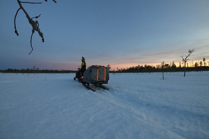 3 Days Raid Snowmobile in Finnish Lapland - Day two: village customs, food, fishing, and snowshoes