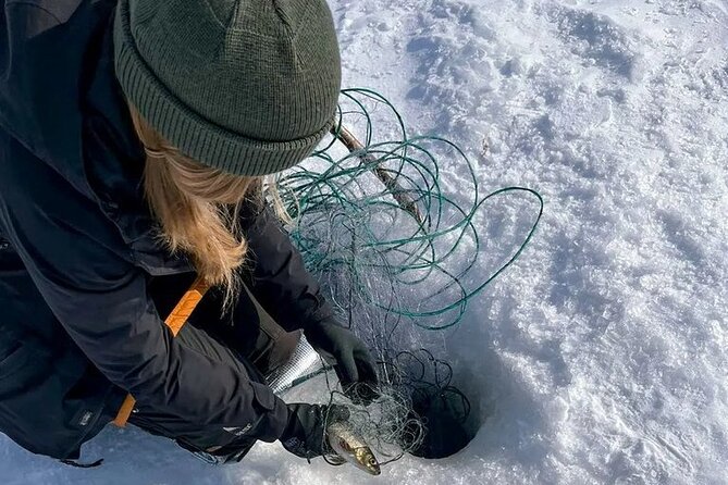 Arctic Fishing & Open Fire Cooking - Drilling through the ice at Rahajärvi