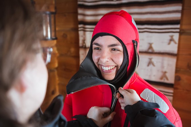 Aurora Ice Floating in Rovaniemi - Getting suited up beside the water