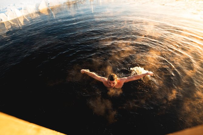 Best Of Lapland: Sauna, Ice swimming, Dinner & Northern Lights - The ice swim at an Arctic lake
