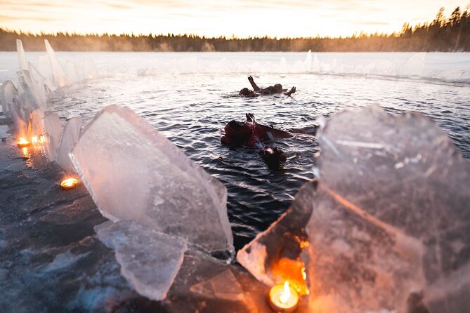 Daytime Arctic Ice-Floating in Rovaniemi, Small-Group - Sliding into an icy lake near Rovaniemi