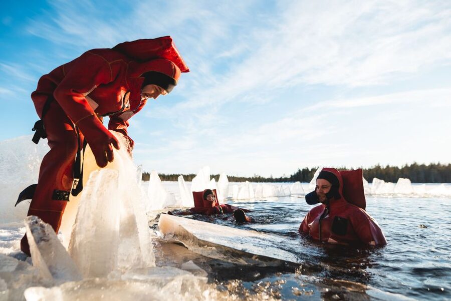 Daytime Ice Floating Rovaniemi, Frozen Lake Experience - Changing into the rescue suit