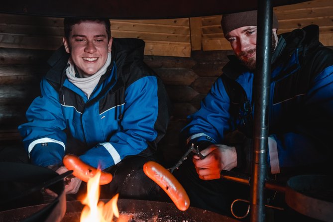 Evening Escape - Snowmobile safari and campfire in Rovaniemi - Leaving central Rovaniemi after dark