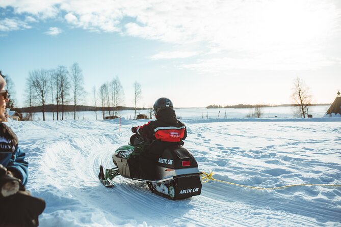Family Snowmobiling in Rovaniemi, Apukka Resort - Riding into Rovaniemi’s snowy forest