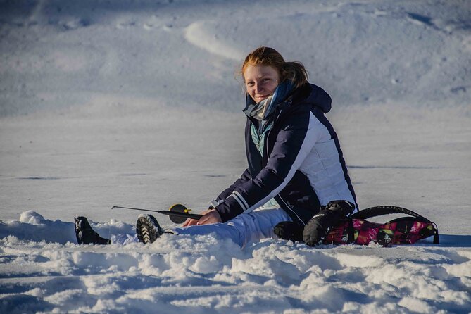 First Ice Fishing Experience in Rovaniemi - Learning to drill through the ice