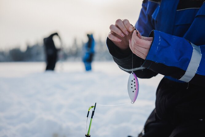 Ice Fishing and Snowmobile Safari Combo in Lapland - Ice fishing on a frozen lake