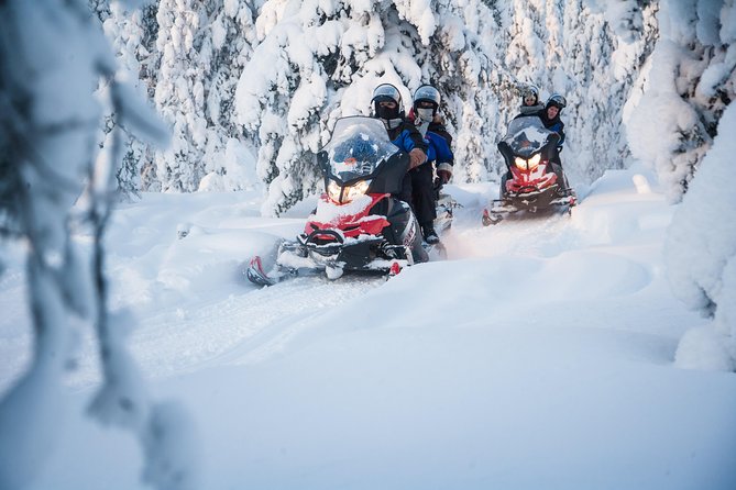 Lappish Lunch Break -Snowmobiling, ice fishing and tasty food - Reindeer soup beside the ice