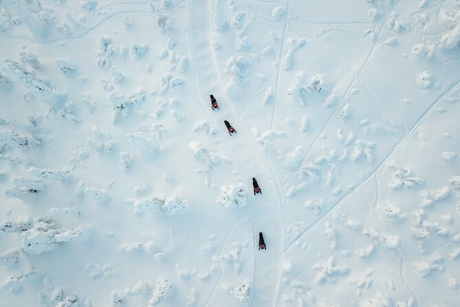 Lappish Lunch Break -Snowmobiling, ice fishing and tasty food - Getting warm before heading into the cold