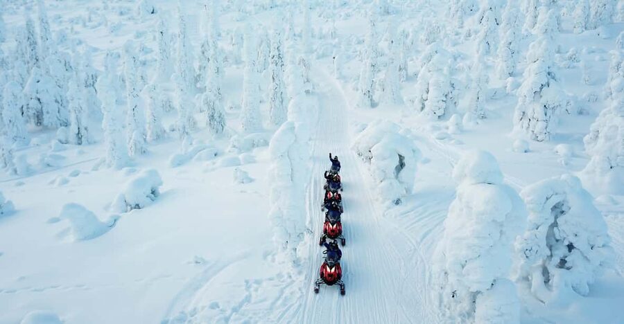 Levi: Easy Snowmobile Safari into the Nature - Sharing the driving across frozen lakes