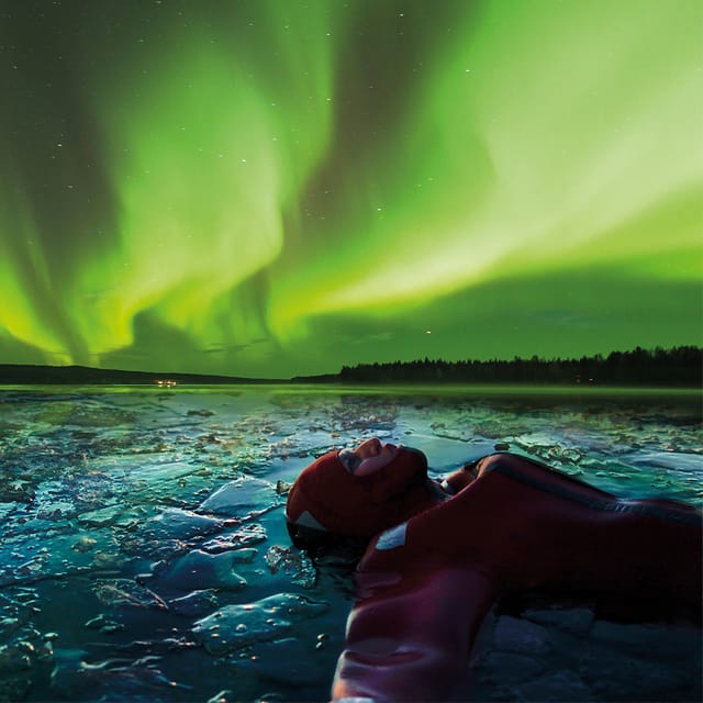 Levi: Ice Floating and Northern Lights Tour - Getting into the Arctic water