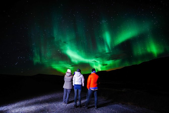 Northern Lights Hunt from Rovaniemi with Folk Tales and Snacks over Campfire - Finding darkness beside a Finnish lake