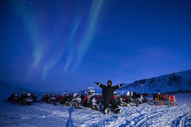 Northern Lights Hunting with Snowmobiles - Riding through forests, snowbanks, and frosty trees