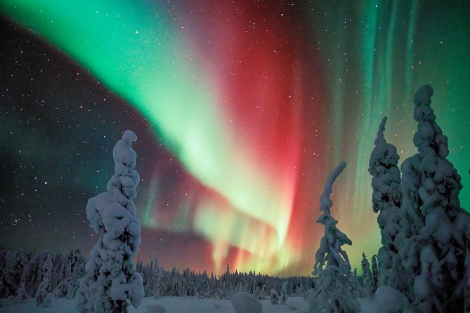 Northern Lights Snowmobile Driving Safari - Warming up inside the wooden tepee