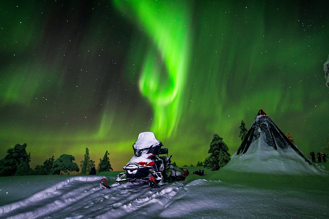 Northern Lights Snowmobile Sleigh Ride - A tepee fire, warm drinks, and barbecue snacks