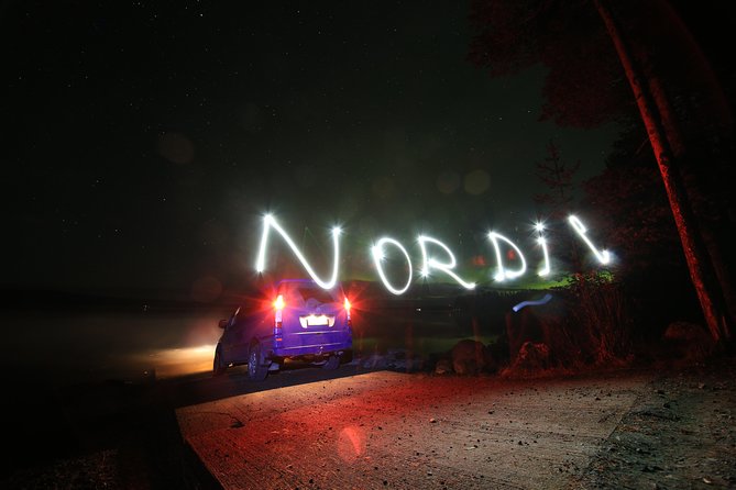 Private Northern Lights Hunting Expedition - Waiting by the fire in the Lappish wilderness