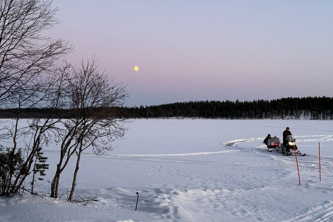 Reindeer Husbandry with Snowmobile Sleigh Ride and Cabin Lunch - The snowmobile sleigh ride across lake and forest