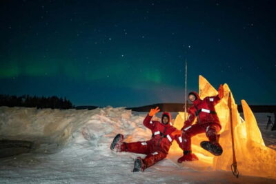 Ice Floating in Forest Lake with Aurora Borealis