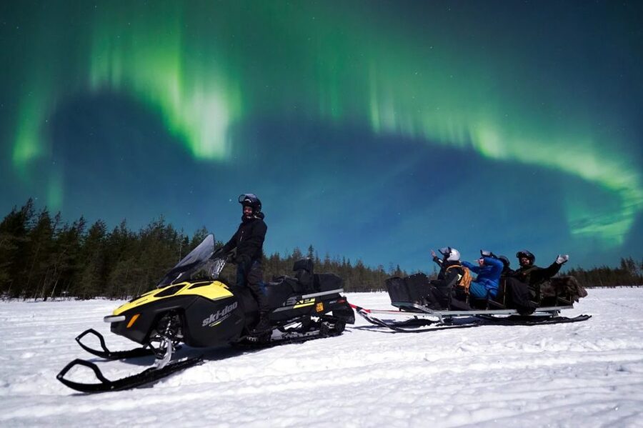 Rovaniemi: Northern Lights Sleigh Ride - Leaving central Rovaniemi by snowmobile sleigh