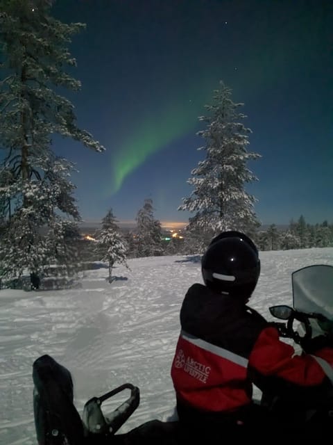 Rovaniemi: Northern Lights Snowmobile Safari with Campfire - Riding into Rovaniemi’s dark Arctic country