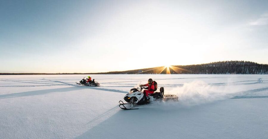 Rovaniemi: Snowmobile and Ice Fishing Adventure with Lunch - Drilling an ice-fishing hole