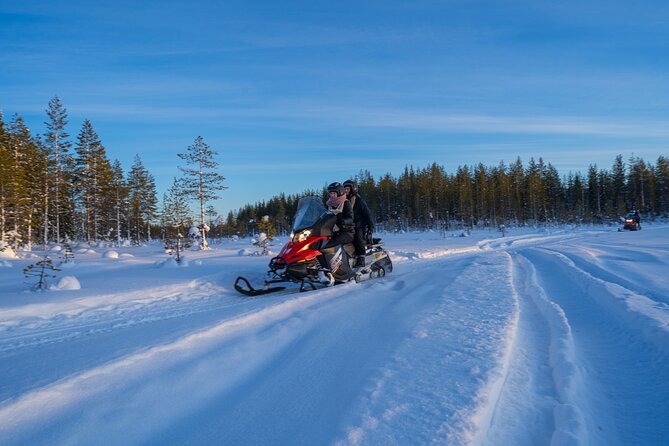 Small-Group Snowmobile Experience in Rovaniemi - A bonfire, sausages, and warm juice