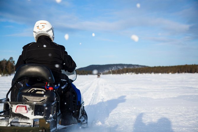 Snowmobile Safari to Lake Inari, meet & feed Reindeers, Lunch - Sharing a snowmobile across frozen Lake Inari