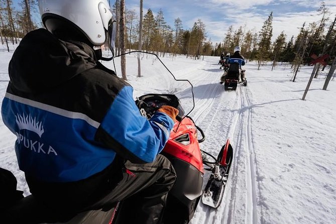 Snowmobiling and ice fishing in Apukka Resort, Rovaniemi - What the snowmobile ride feels like for first-time drivers