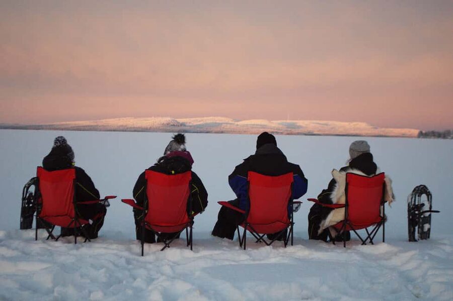 Snowshoe experience with traditional beverages in Lapland - Hot berry juice, grilled sausage, and a useful pause