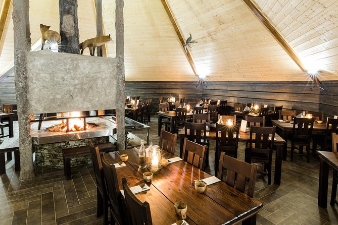 To the Kingdom of Snow and Ice – Full day snowmobile safari to ice hotel - Glow-fried salmon inside a Kota teepee